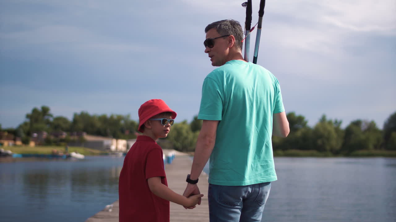 Father and Son Fishing on a Lakeside Pier