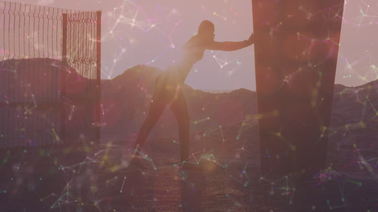 해변에서 스트레칭 운동을 하는 아프리카계 미국인 피트맨에 대한 연결망