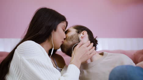 young people kissing at home