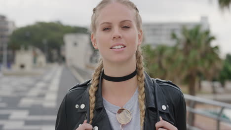 portrait stylish young blonde woman smiling confident enjoying independent lifestyle attractive caucasian woman wearing leather jacket