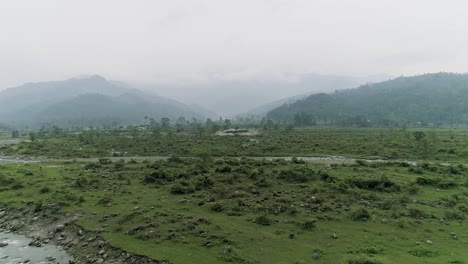 river branches with muddy water flowing furiously from the mountains after a heavy rain