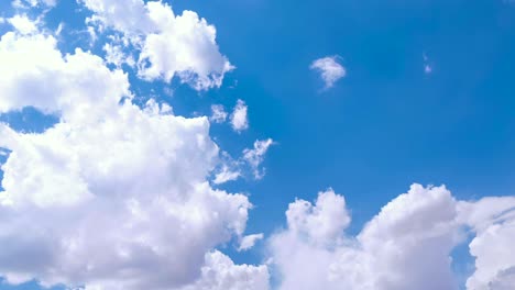 loop of white clouds over blue sky