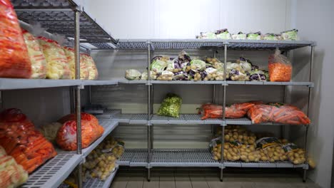 food raw materials are neatly arranged on the shelves of a catering food factory