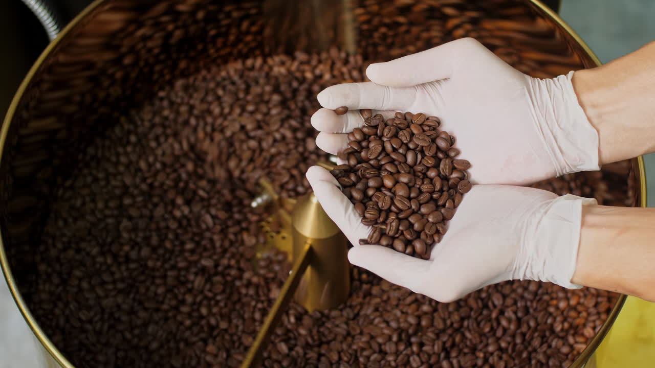 Roasted Coffee Beans In Man'S Hand