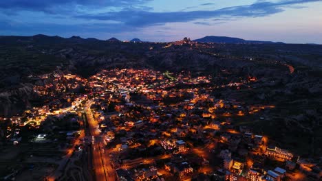 night aerial view of cappadocia city glowing with lights