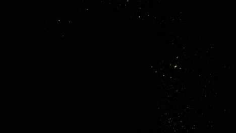 abstract gold flying stars and bokeh glitter dust particles trail crossing the screen on black