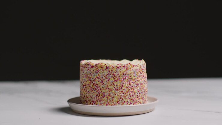 Studio Shot Of Birthday Cake Covered With Hundreds And Thousands Decorations 6