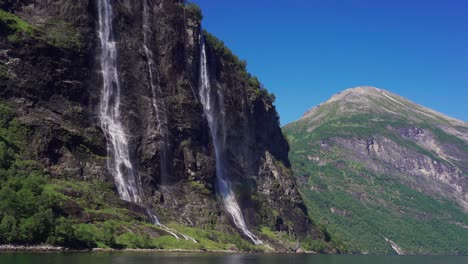 the sven sisters waterfall - an iconic feature of the geiranger fjord, norway