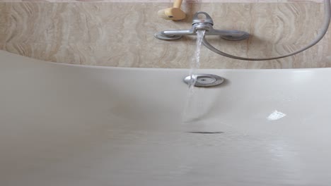 water filling a bathtub