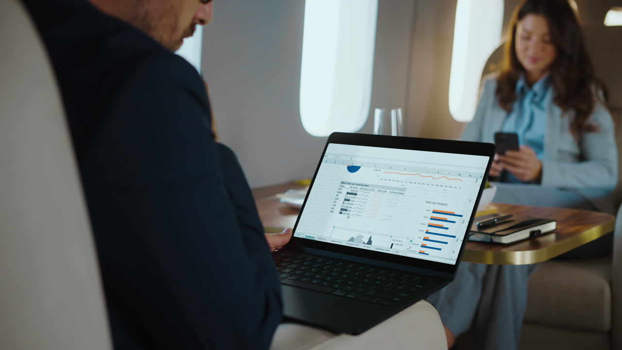 Business professionals working on a private jet