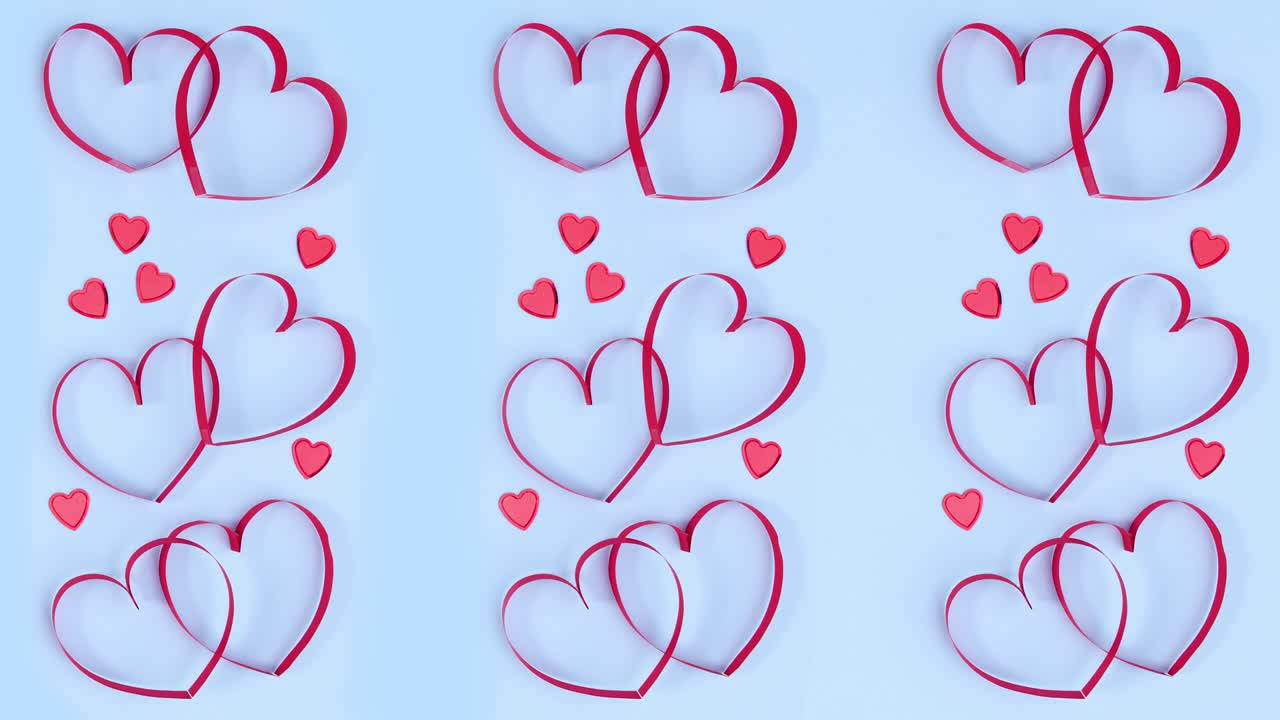 Cuori rossi romantici di San Valentino su tema blu pastello. Stop motion
