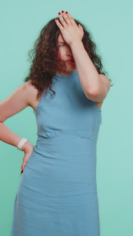 young woman making face palm gesture feeling bored disappointed in result bad news sorrowful