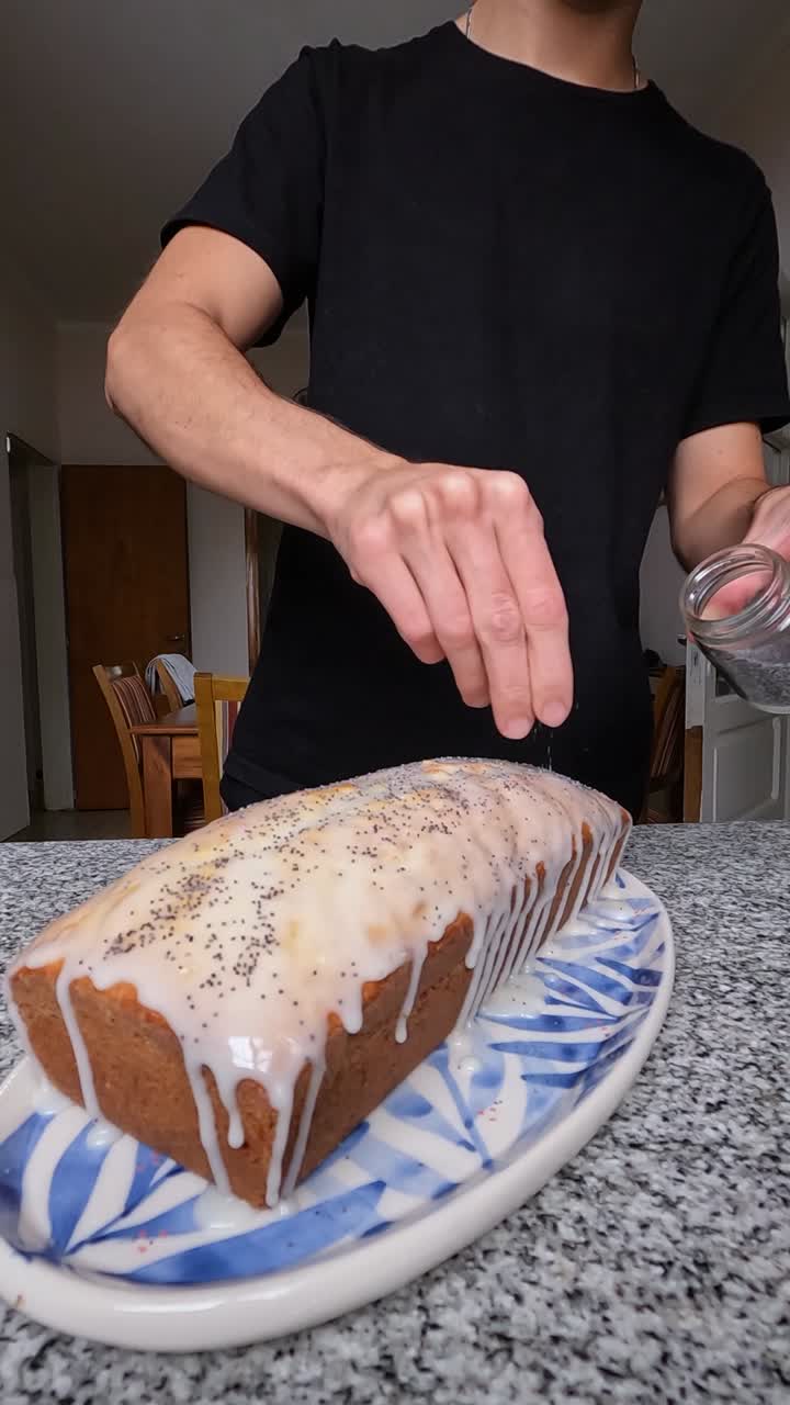 Man finishing lemon cake with a mix of natural seeds