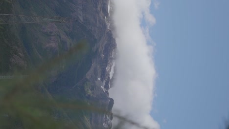 Majestic-snow-capped-mountains-towering-above-the-clouds-in-a-breathtakingly-beautiful-landscape-shot-in-Patagonia,-Argentina