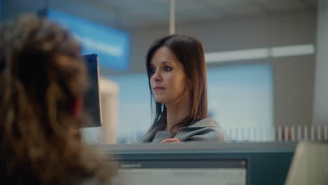 airport employee assisting passenger at the counter