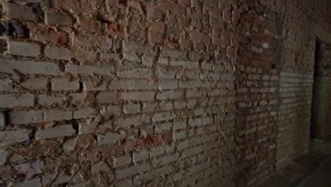 Interior of the old shabby house with brick walls. Large building under the renovation.