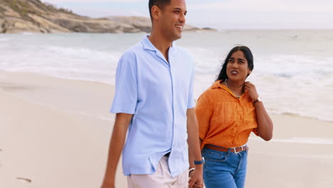 Happy-couple,-walking-and-holding-hands-on-beach