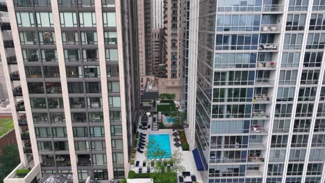 rooftop pool and green space at upscale residential urban apartment building in usa city