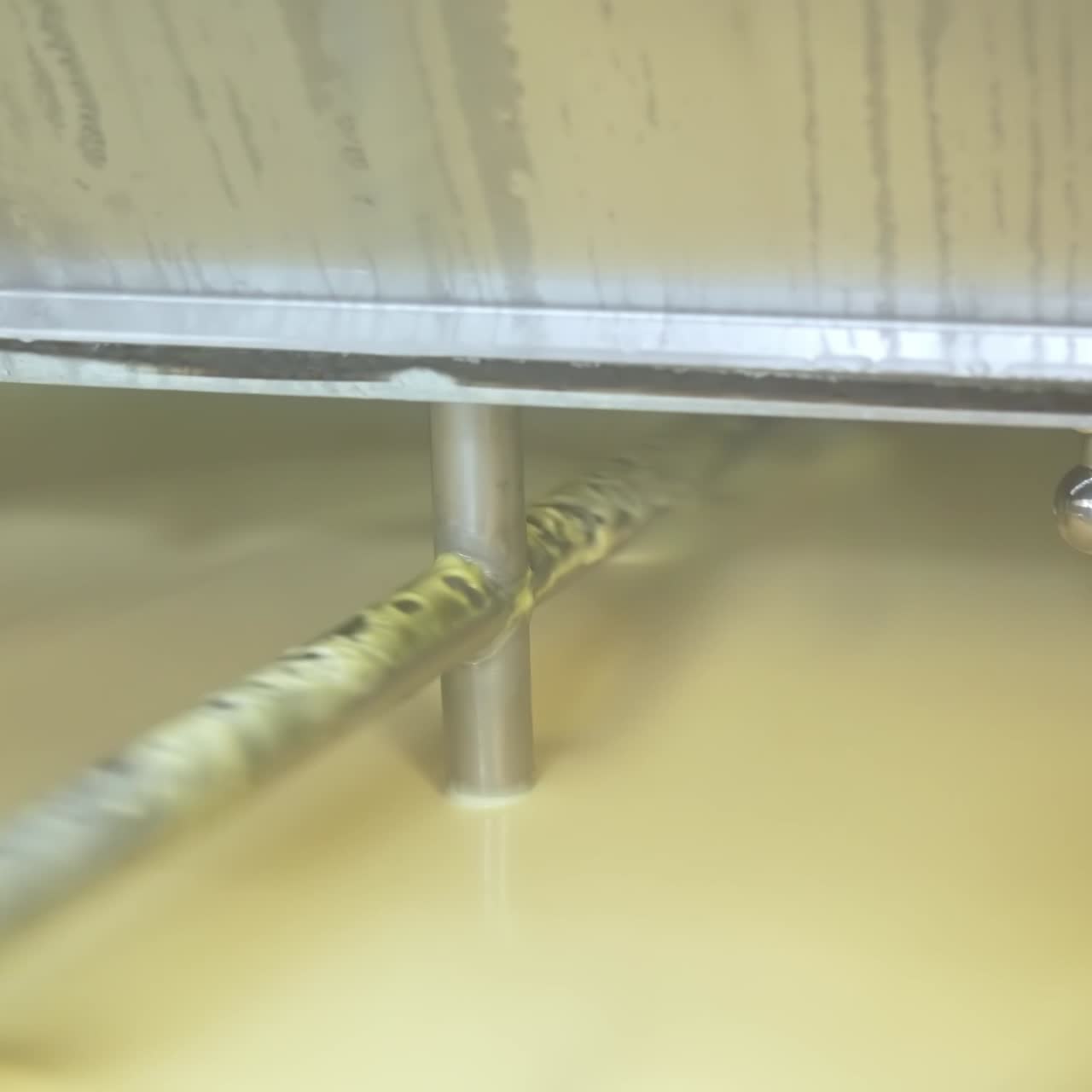 Butter production line at dairy industry. Close up view of butter production at dairy plant