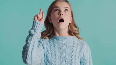 teenage caucasian girl with new idea in front of the camera.