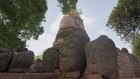 buddhist head statues in historic ancient ruins of ayutthaya, thailand