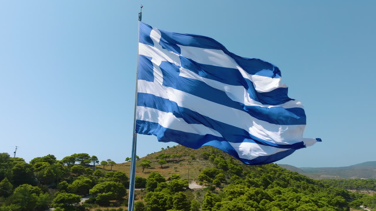 Greek Flag Waving over Hills