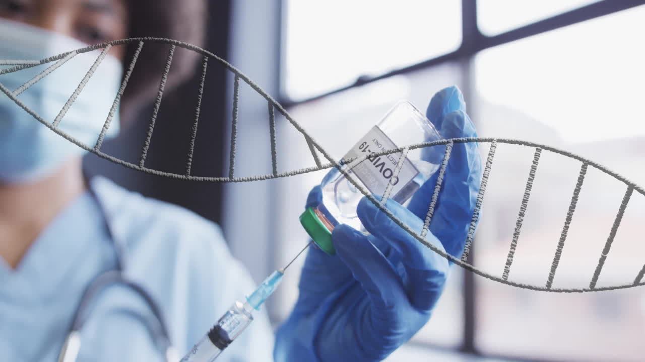 Animation of dna strand over african american female doctor holding vial and syringe