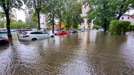 city streets turn into rivers as floodwaters rise, disrupting traffic and daily life in jelgava latvia