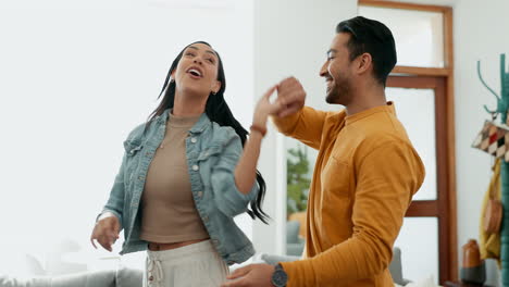 Couple,-dancing-in-living-room-and-love