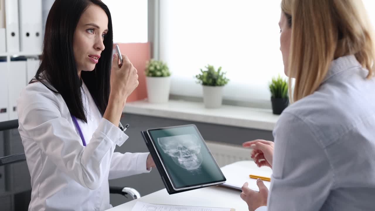 Doctor explaining x-ray results to patient