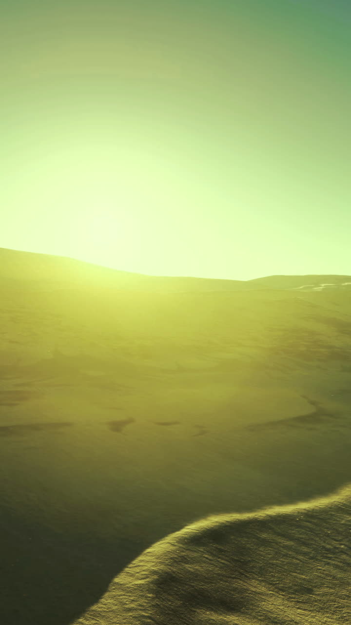Golden rays illuminate the desert landscape at sunrise
