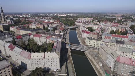 flight over the river flowing through the historic part of olomouc, bridges, streets and the cathedral