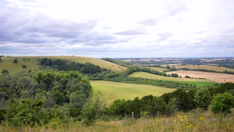 Wide-panning-shot-of-Old-Winchester-Hill-in-Hampshire-on-a-sunny-and-cloudy-midday