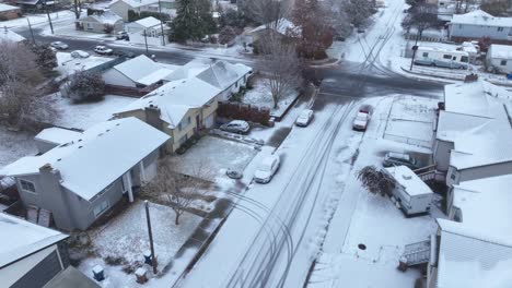 rising aerial view of houses recently snowed in