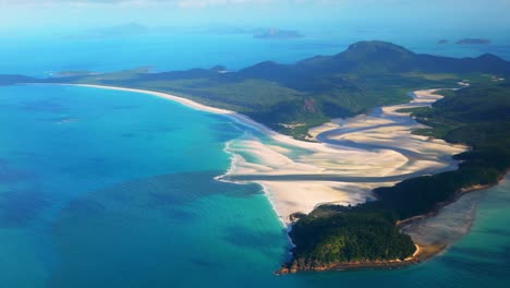 hill inlet lookout whitehaven beach north end scenic flight aerial drone whitsundays islands australia qld stunning white sand outer great barrier reef clear blue aqua ocean waters pan follow motion