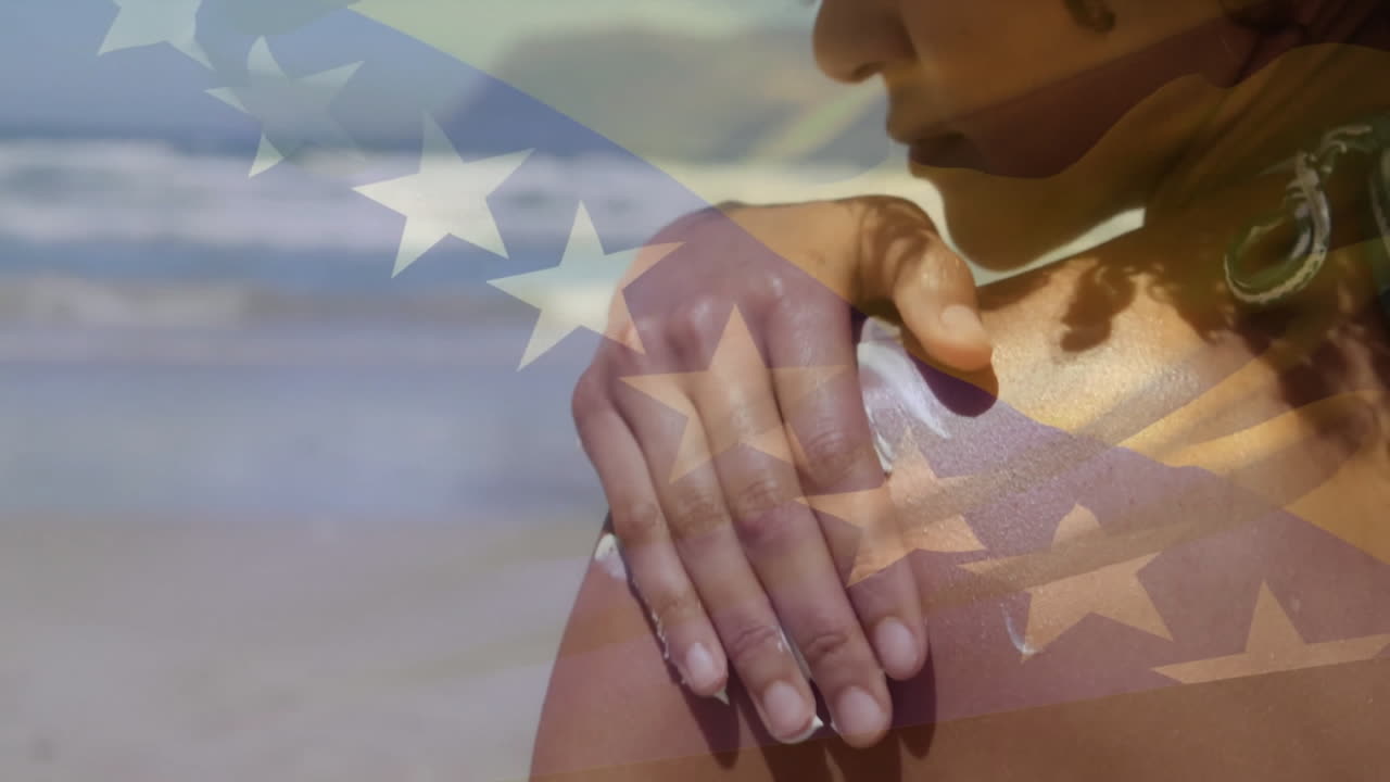 Applying sunscreen on shoulder, person with stars animation overlay at beach