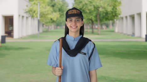 happy indian female security guard smiling