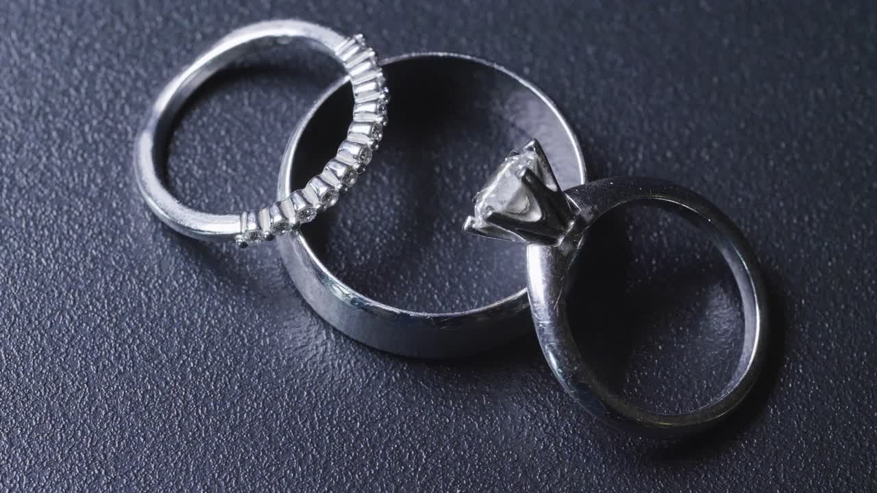 Light Passes On The Classic Silver Wedding Band Rings. Close Up Shot