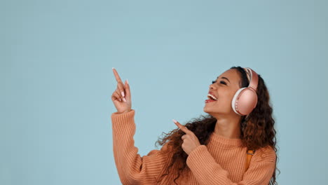 Pointing,-portrait-and-woman-with-headphones