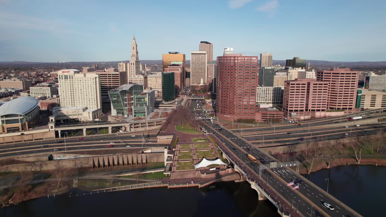 Rich aerial of Hartford, CT city center with morning traffic heading into downtown, 4K