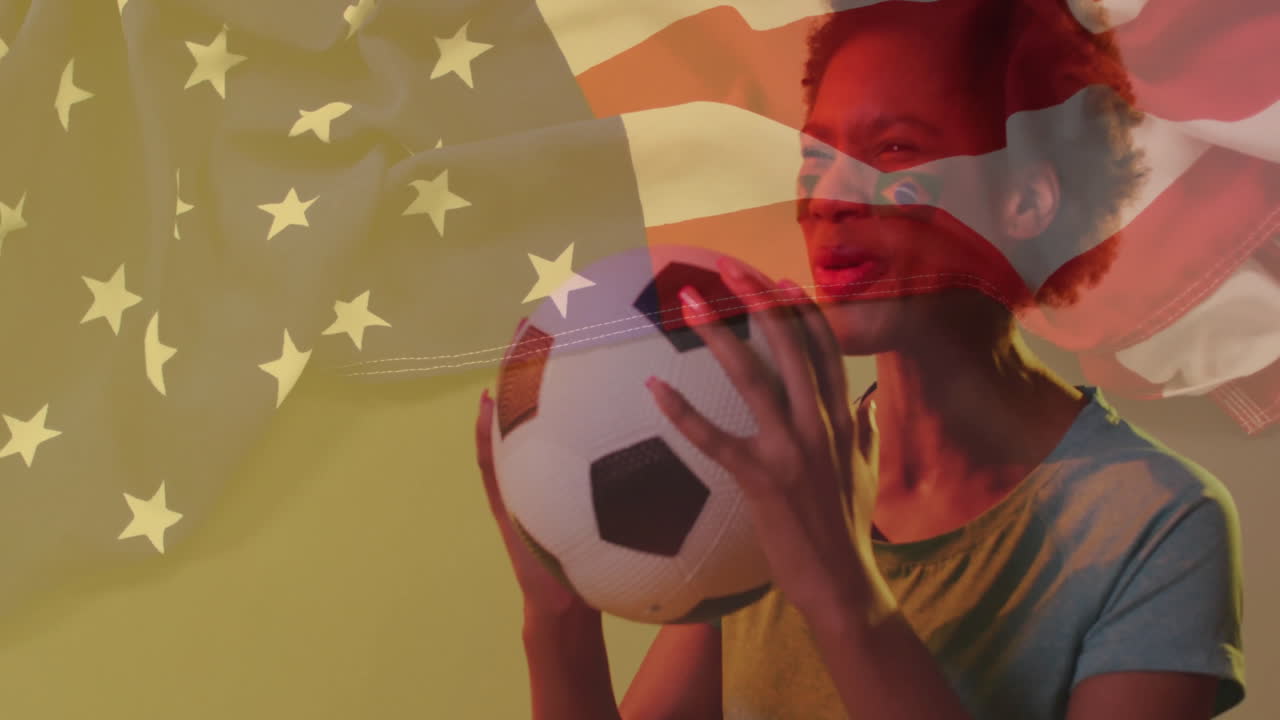 Holding soccer ball, person with American flag animation in background