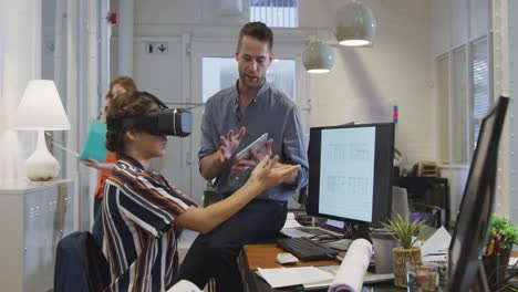 businesswoman wearing vr helmet in modern office