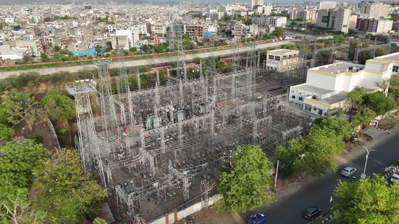 Busy road networks captured from above in Jaipur where power lines pass through the city