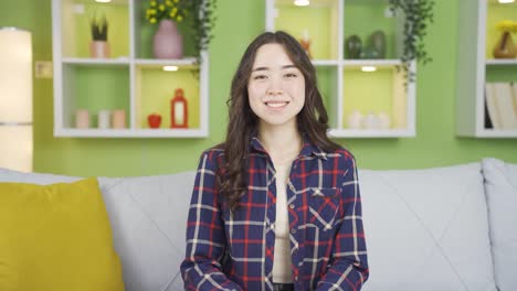 Happy-Asian-young-woman-smiling.