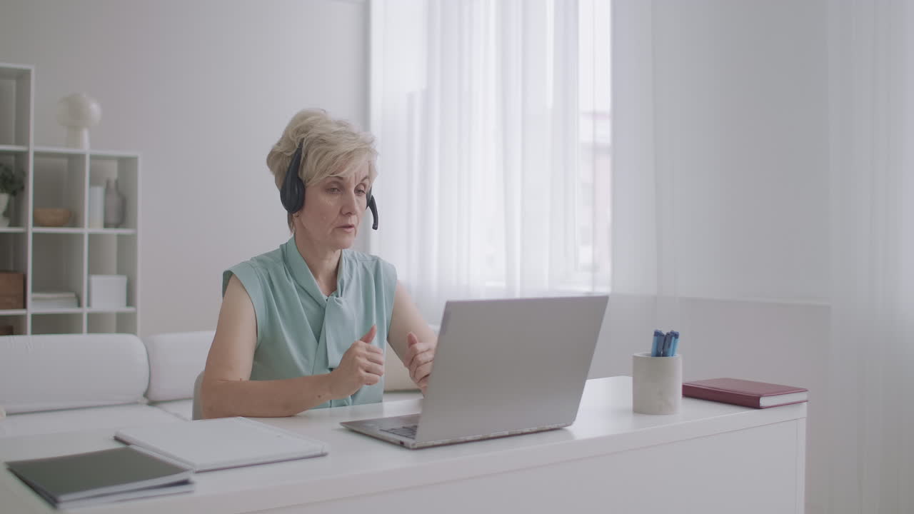 female specialist is working from home talking with colleagues partners and clients by internet online chat and video call technology