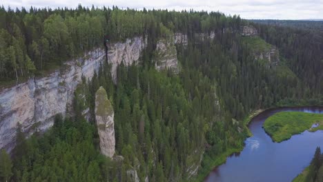 aerial view of a canyon with a river and steep cliffs