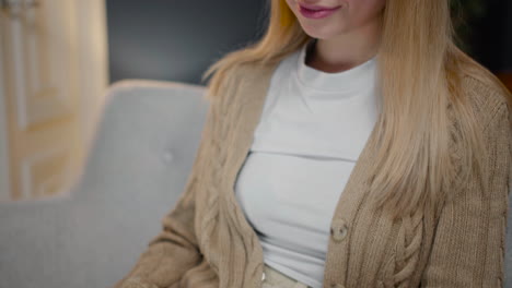 Close-Up-Of-A-Young-Woman-Typing-On-Laptop-Computer-While-Sitting-On-Couch-At-Home