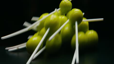green lollypop candies rotating. broll detail shot. blur effect.