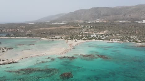 Aerial-view-of-Elafonisi-lagoon-with-idyllic-exotic-beaches-and-crystal-clear-waters-in-Crete,-Greece