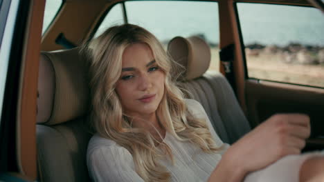 woman in a vintage car